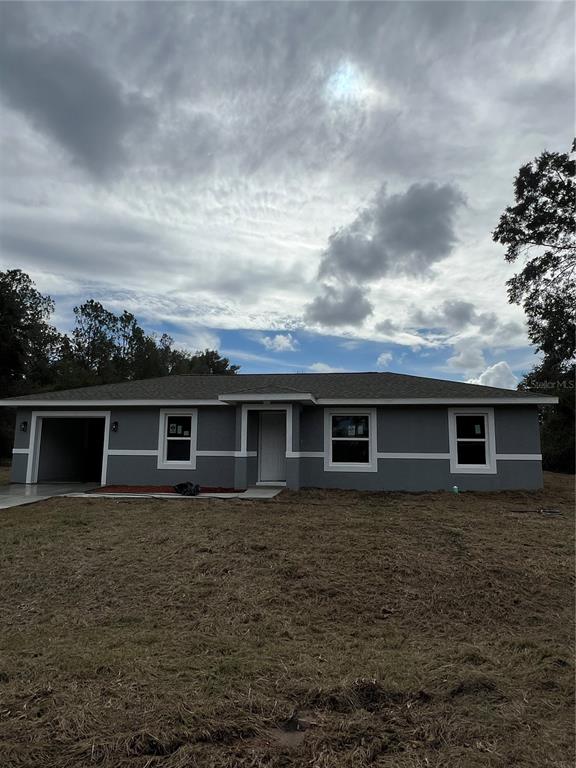 21260 Southwest Marine Boulevard Dunnellon, FL 34431 - Photo 1 of 13 front view of house with a yard