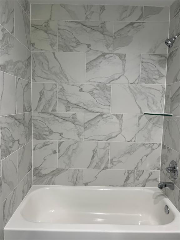 21260 Southwest Marine Boulevard Dunnellon, FL 34431 - Photo 7 of 13 a bathroom with a bathtub