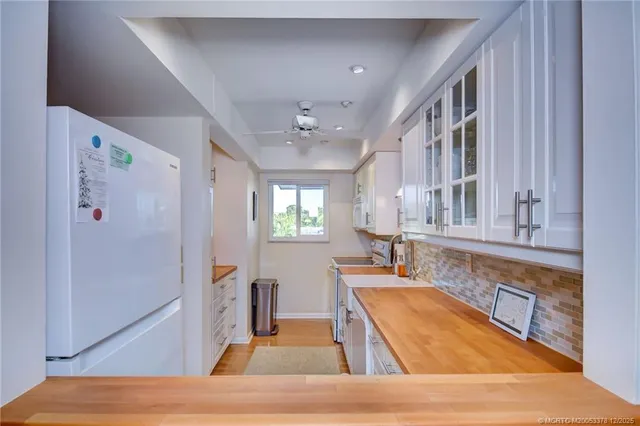 a room with lots of counter space and a window