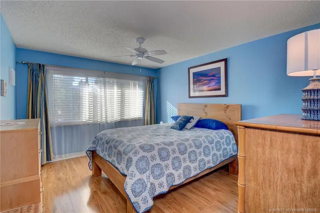 a bedroom with bed and window