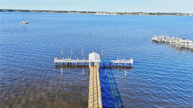 an aerial view of multiple houses with yard