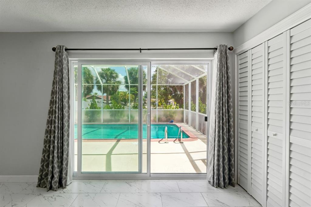 6955 Bottle Brush Drive Port Richey, FL 34668 - Photo 26 of 61 a view of a room with a large window
