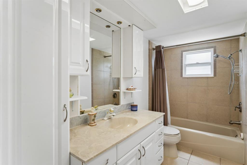 6955 Bottle Brush Drive Port Richey, FL 34668 - Photo 31 of 61 a bathroom with a sink toilet tub and shower