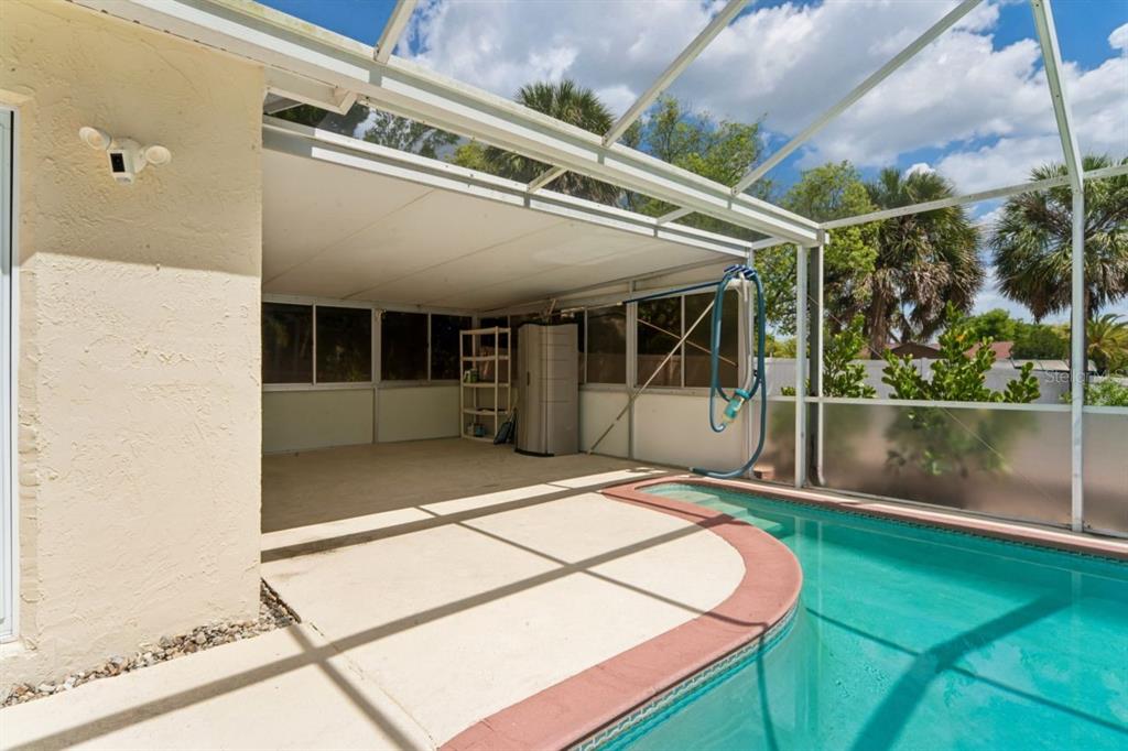6955 Bottle Brush Drive Port Richey, FL 34668 - Photo 41 of 61 a view of a patio with a backyard