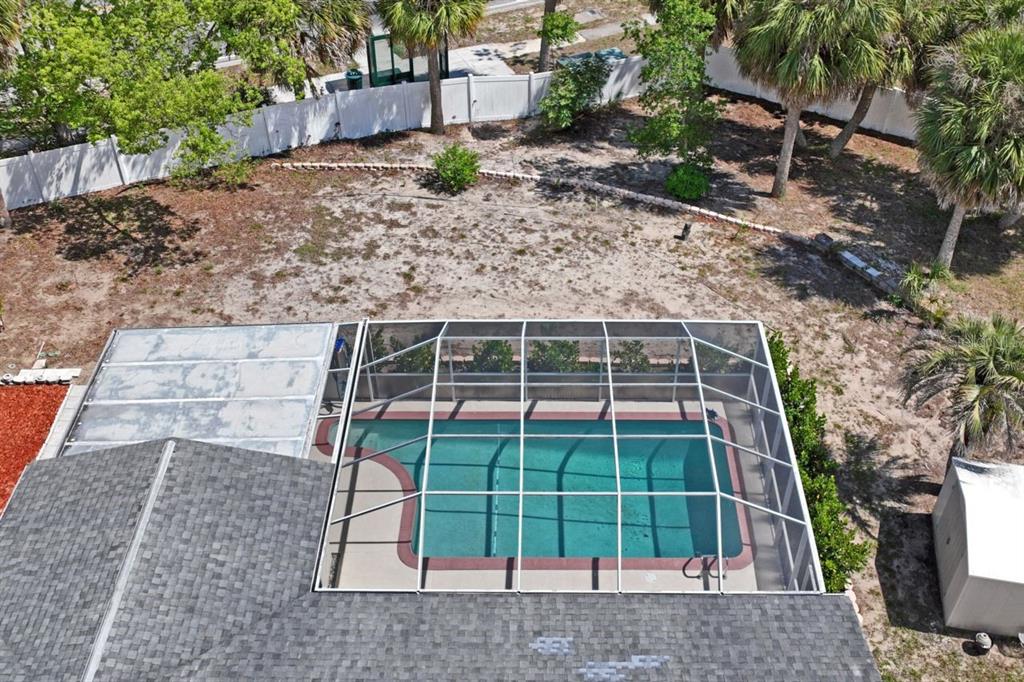 6955 Bottle Brush Drive Port Richey, FL 34668 - Photo 43 of 61 a view of a backyard with a deck