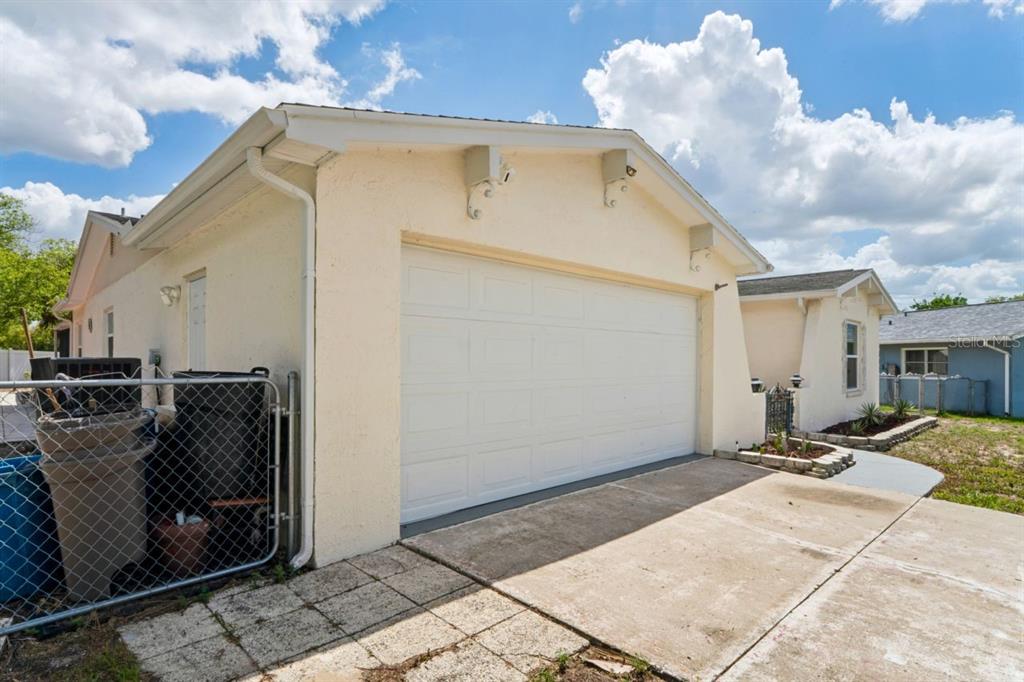 6955 Bottle Brush Drive Port Richey, FL 34668 - Photo 52 of 61 a view of a house with backyard