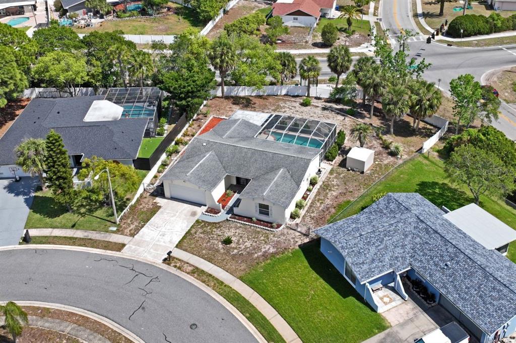 6955 Bottle Brush Drive Port Richey, FL 34668 - Photo 57 of 61 an aerial view of a house with a garden