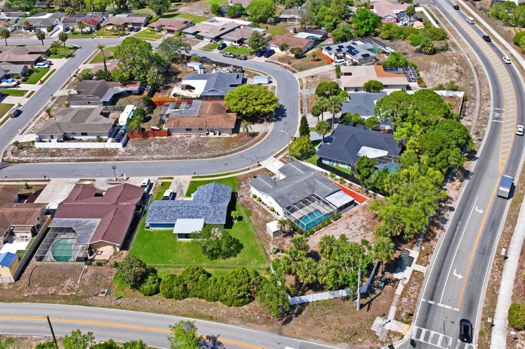 6955 Bottle Brush Drive Port Richey, FL 34668 - Photo 58 of 61 an aerial view of multiple houses with yard