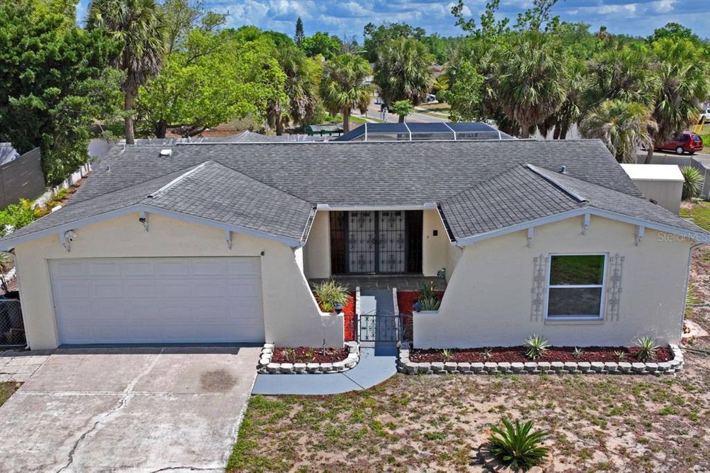6955 Bottle Brush Drive Port Richey, FL 34668 - Photo 59 of 61 a view of house with outdoor space