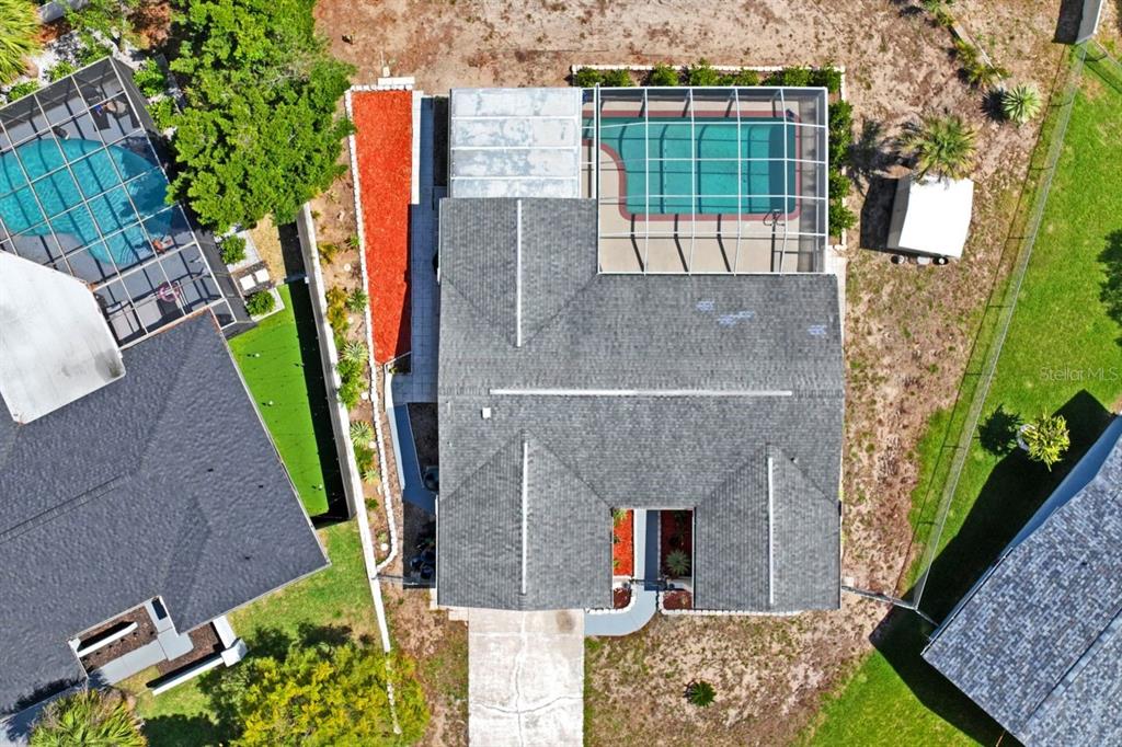 6955 Bottle Brush Drive Port Richey, FL 34668 - Photo 60 of 61 an aerial view of a house with balcony and garden