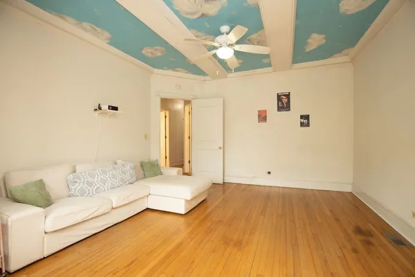 a spacious bedroom with a bed and a couch