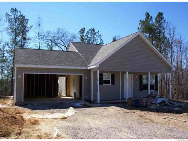 3637 Blue Blossom Drive Raleigh, NC 27616 - Photo 1 of 1 a front view of a house with a yard and garage