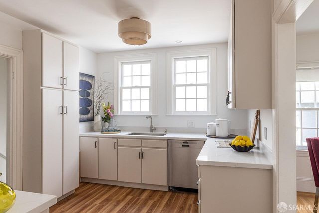 a bed room with a bed window and a potted plant