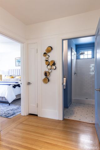 a bedroom with bed and window