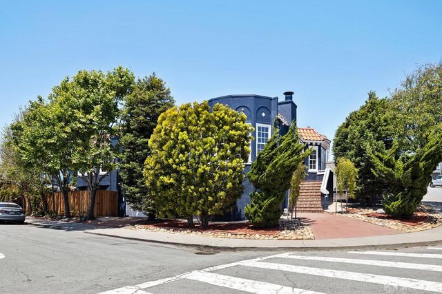 a view of a house with a street