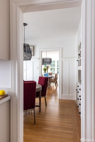 a view of a livingroom with furniture window and wooden floor