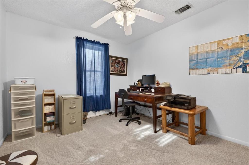 1706 Hitching Post Road Granbury, TX 76049 - Photo 23 of 40 a view of a workspace with furniture