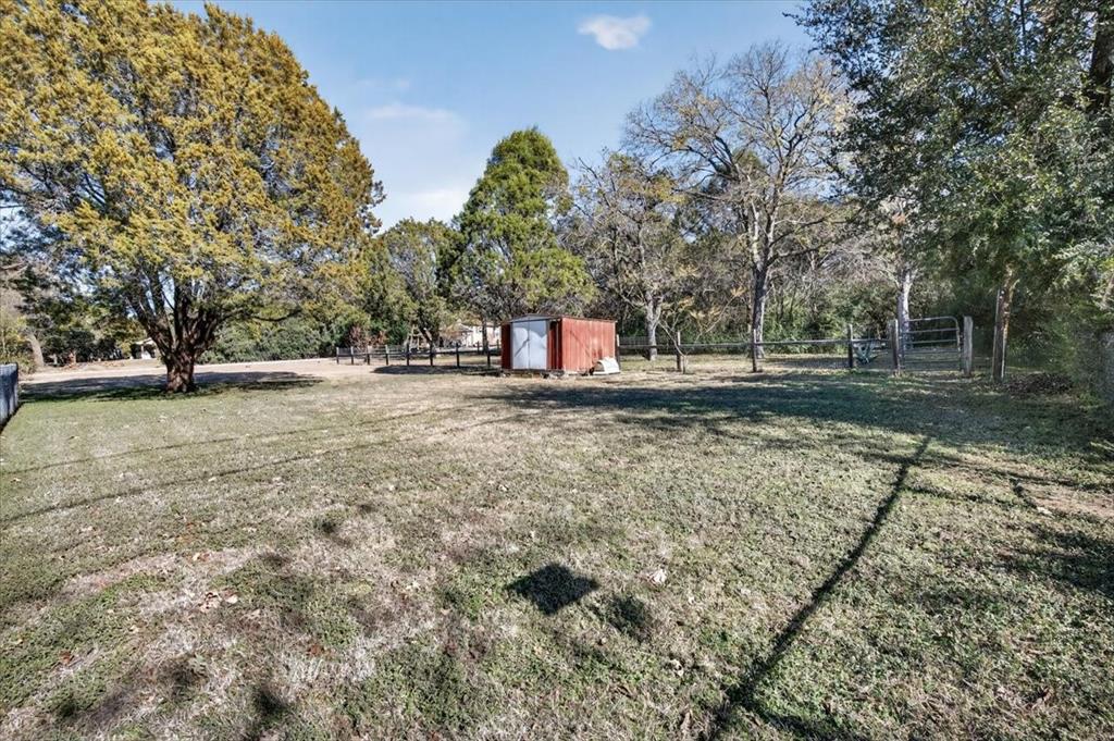 1706 Hitching Post Road Granbury, TX 76049 - Photo 28 of 40 a view of a yard with wooden fence