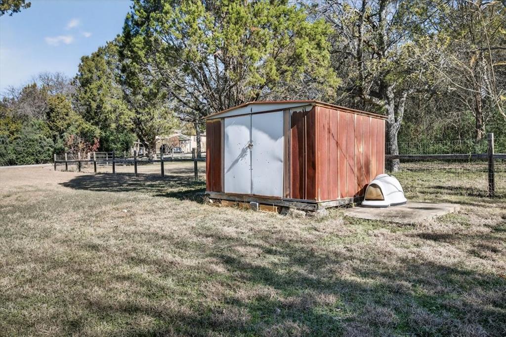 1706 Hitching Post Road Granbury, TX 76049 - Photo 29 of 40 a view of backyard with large tree