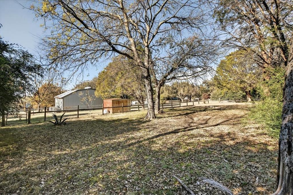 1706 Hitching Post Road Granbury, TX 76049 - Photo 33 of 40 a view of yard with trees