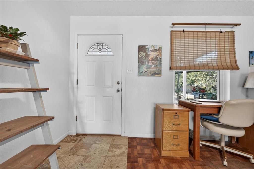 1706 Hitching Post Road Granbury, TX 76049 - Photo 6 of 40 a view of a workspace with furniture and a window