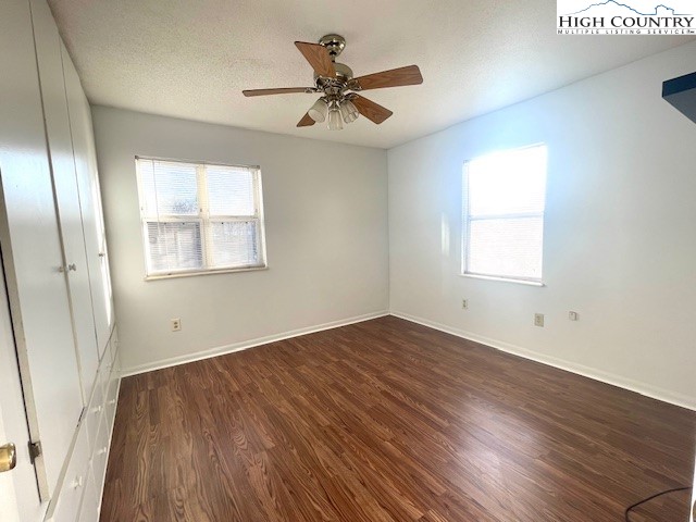 229 East King Street, Unit 27 Boone, NC 28607 - Photo 8 of 13 wooden floor in an empty room with a window