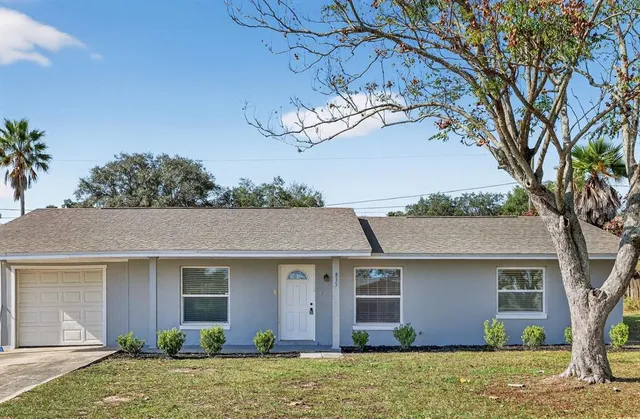 front view of a house with a yard
