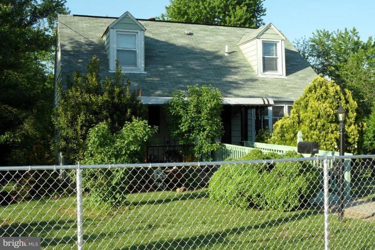 304 Charles Road Linthicum, MD 21090 - Photo 2 of 11 a view of a house with a small yard and plants
