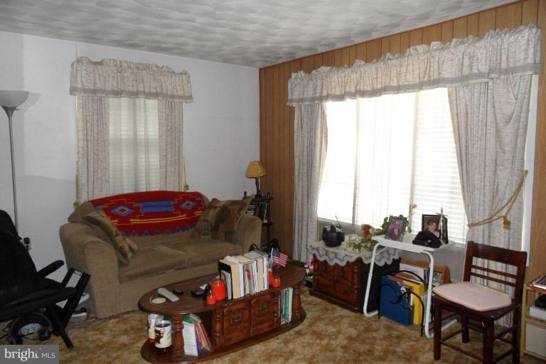 304 Charles Road Linthicum, MD 21090 - Photo 4 of 11 a living room with furniture and a window