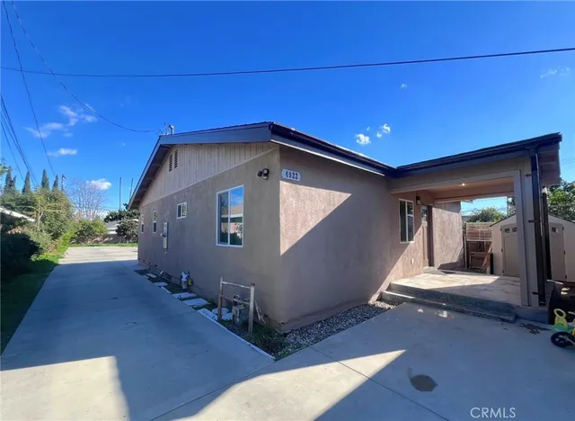 a view of a house with wooden floor and roof