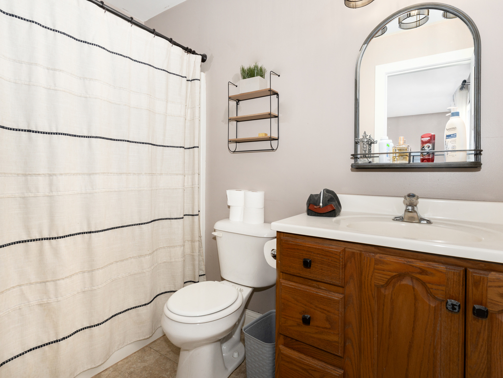3964 East 2259th Road Serena, IL 60549 - Photo 18 of 36 a bathroom with a sink a toilet and shower