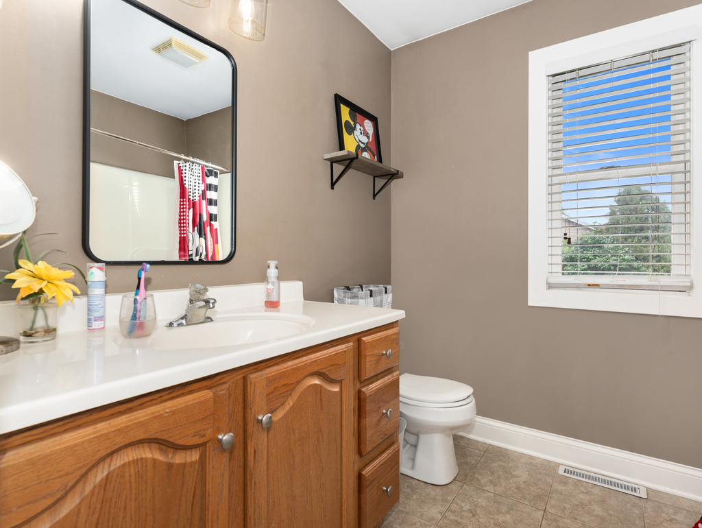 3964 East 2259th Road Serena, IL 60549 - Photo 20 of 36 a bathroom with a toilet sink and mirror