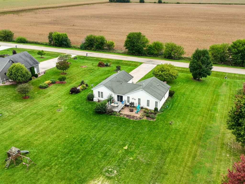 3964 East 2259th Road Serena, IL 60549 - Photo 3 of 36 a view of a garden with an outdoor space and seating area