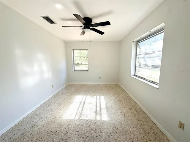 a view of empty room with windows