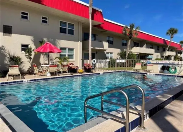 a view of a chairs and table in the patio