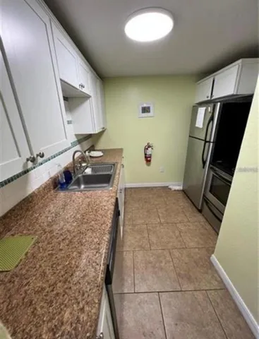 a dining room with furniture window and outdoor view