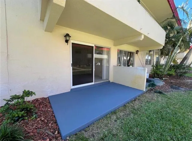 a view of a building with a yard