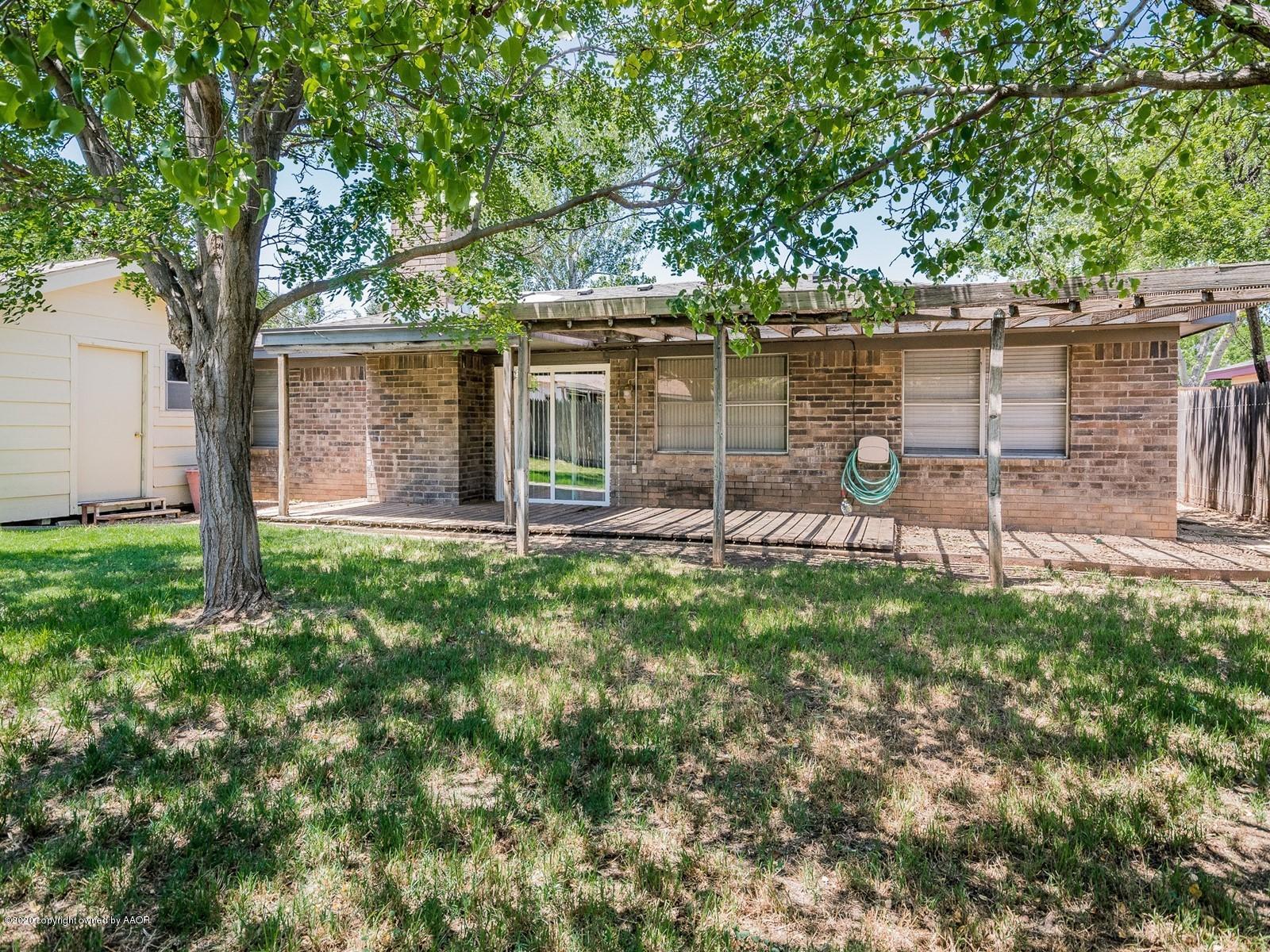 5301 South Milam Street Amarillo, TX 79110 - Photo 20 of 21 a backyard of a house with table and chairs