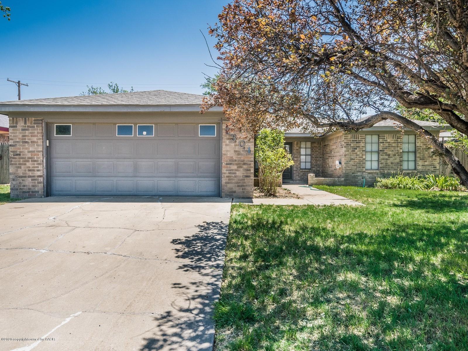 5301 South Milam Street Amarillo, TX 79110 - Photo 2 of 21 a front view of a house with a yard
