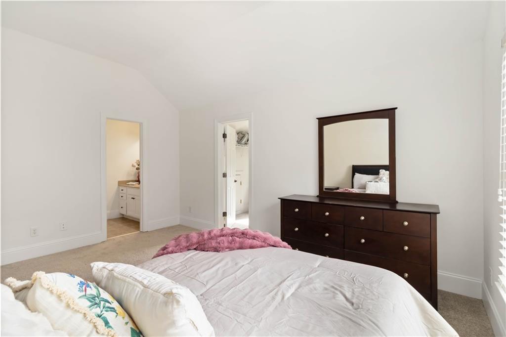 3320 Spencer Street Cumming, GA 30041 - Photo 27 of 70 a bedroom with a bed and a dresser