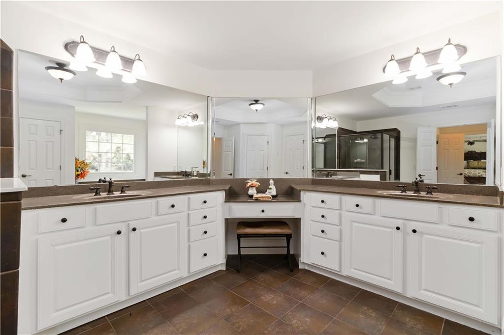 3320 Spencer Street Cumming, GA 30041 - Photo 35 of 70 a spacious en suite bathroom with double sink and a mirror
