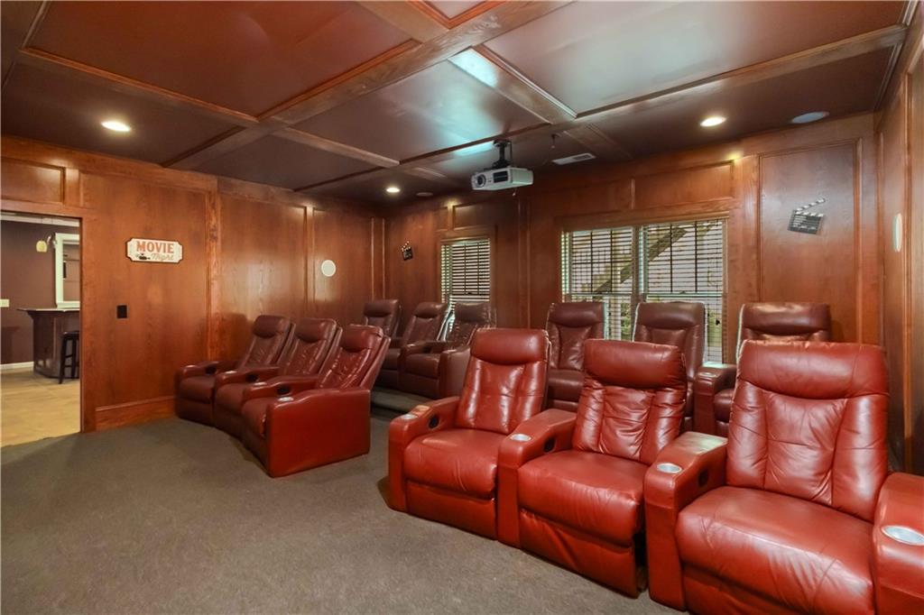 3320 Spencer Street Cumming, GA 30041 - Photo 40 of 70 a media room with lots of chairs and a projector