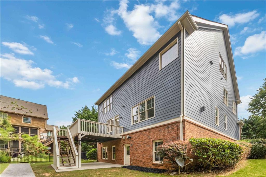3320 Spencer Street Cumming, GA 30041 - Photo 51 of 70 a front view of a house with garden