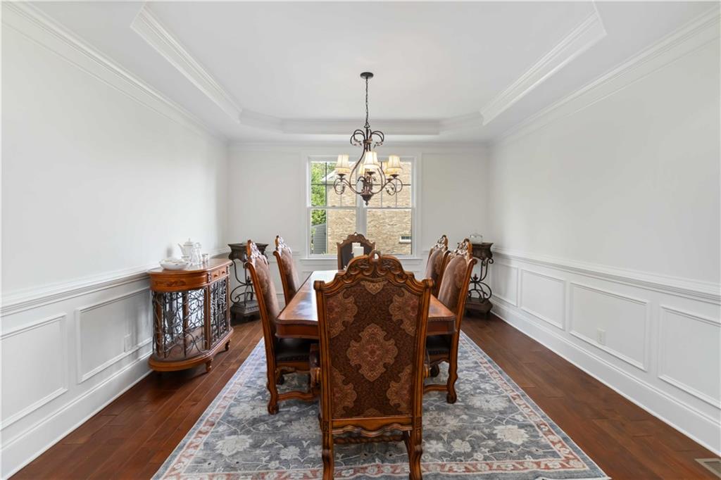 3320 Spencer Street Cumming, GA 30041 - Photo 7 of 70 a view of a dining room with furniture and wooden floor