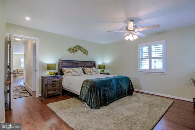 a white bath tub sitting next to a white toilet