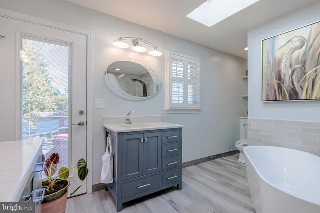 a bedroom with bed and a window