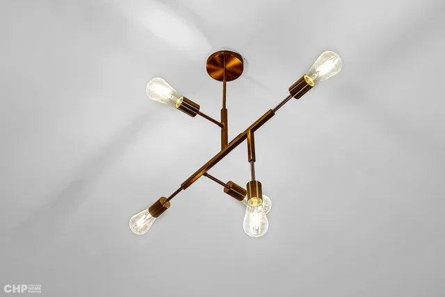 a view of staircase with a table and a potted plant