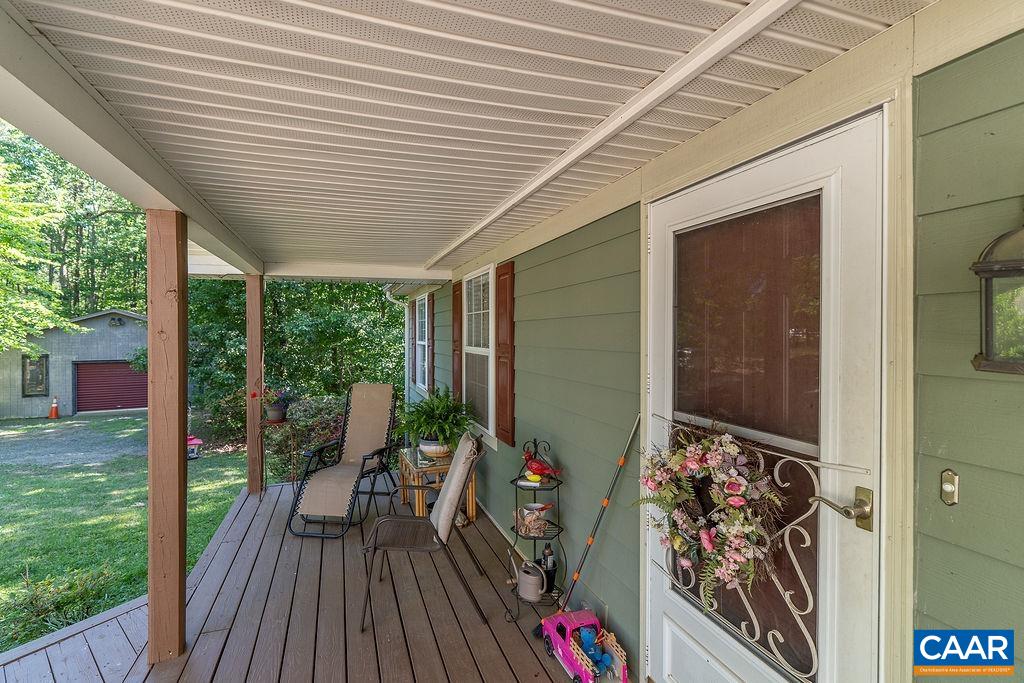 2851 Martin Kings Road Scottsville, VA 24590 - Photo 12 of 67 a view of a deck with wooden floor and outdoor seating