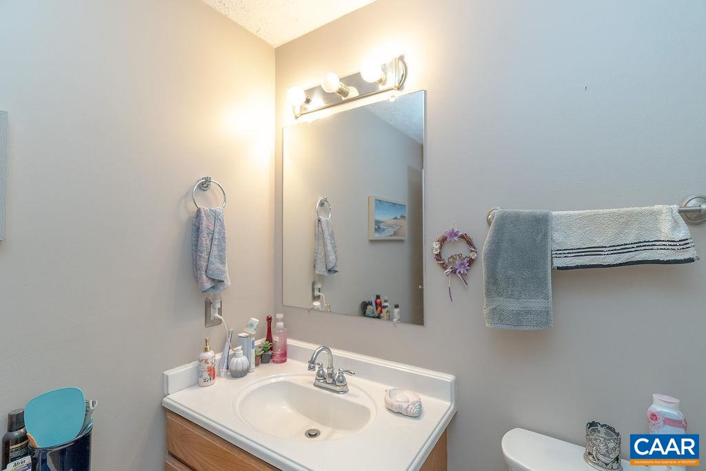 2851 Martin Kings Road Scottsville, VA 24590 - Photo 13 of 67 a bathroom with a sink mirror and toilet