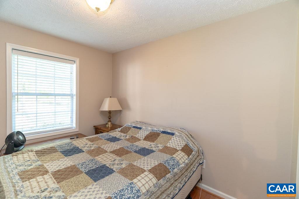2851 Martin Kings Road Scottsville, VA 24590 - Photo 14 of 67 a bedroom with a bed and a window